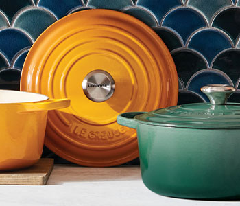cast iron cookware in nectar yellow and artichaut green